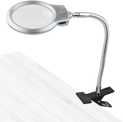 Led magnifying lamp in table